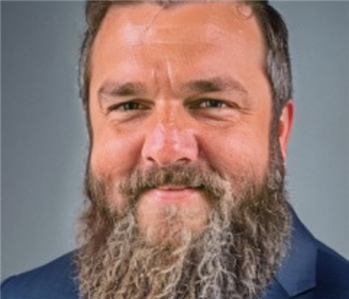 man with beard in suit